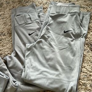 4 pairs of Nike baseball pants 2 small 2 medium